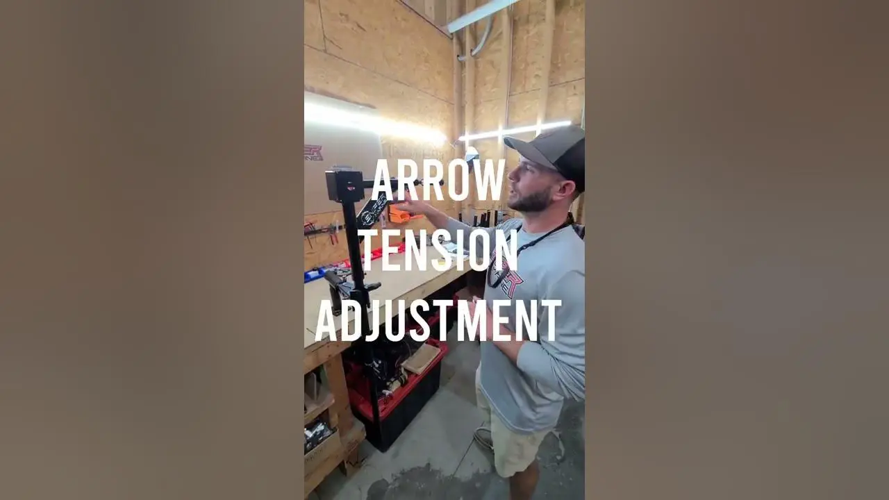Person working on arrow tension adjustment