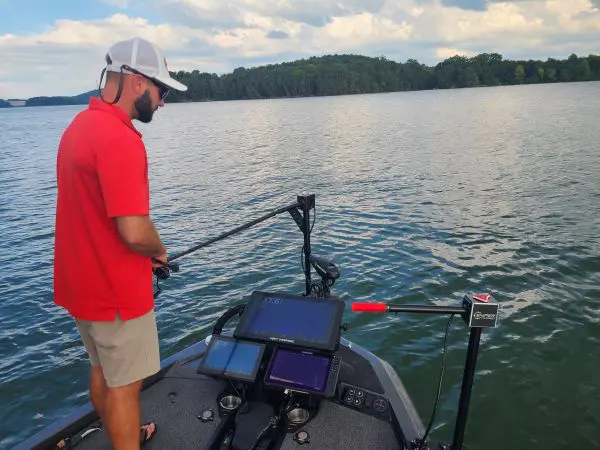 Fisherman in red shirt on lake