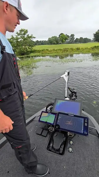 Angler using tech on a fishing boat