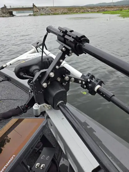 Boat motor with lake in background