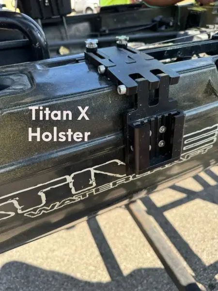 Titan X Holster mounted on vehicle frame.