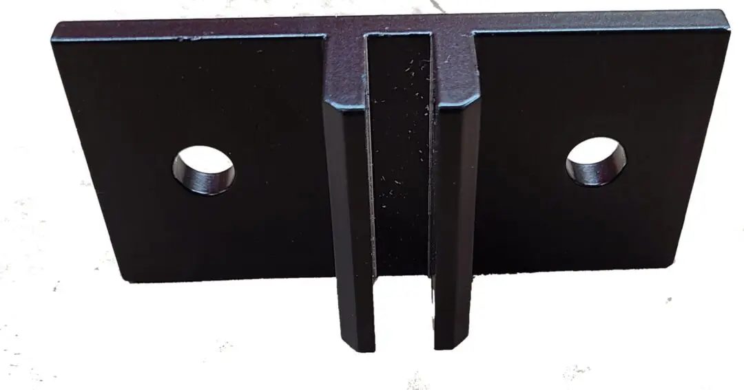 black metal mounting bracket with central slot