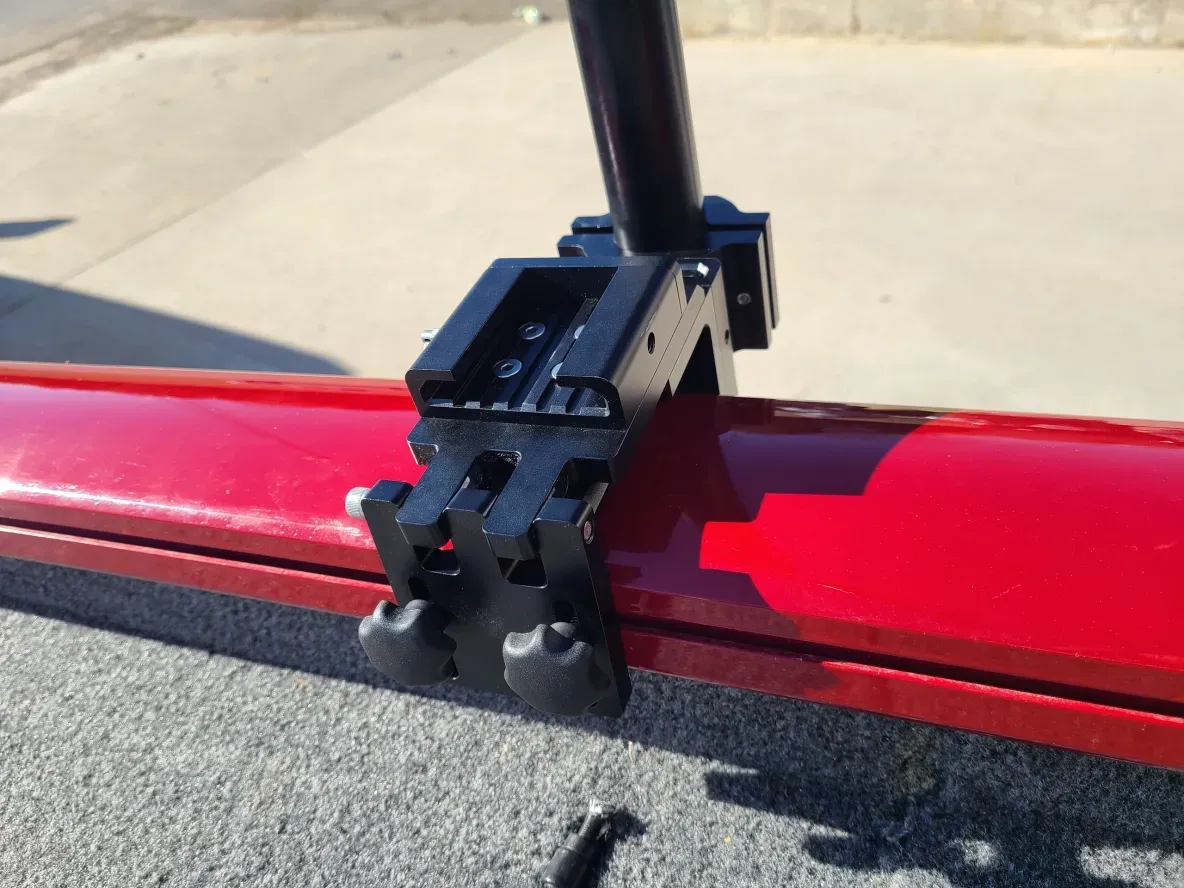 Black clamp on red metal surface